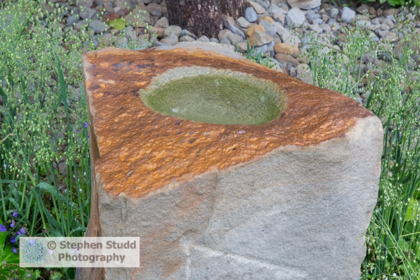 Photographer: Stephen Studd - The M&G Garden, view of Forest of Dean stone boulder carved bird bath - Designer: Cleve West - Sponsor: M&G Investments